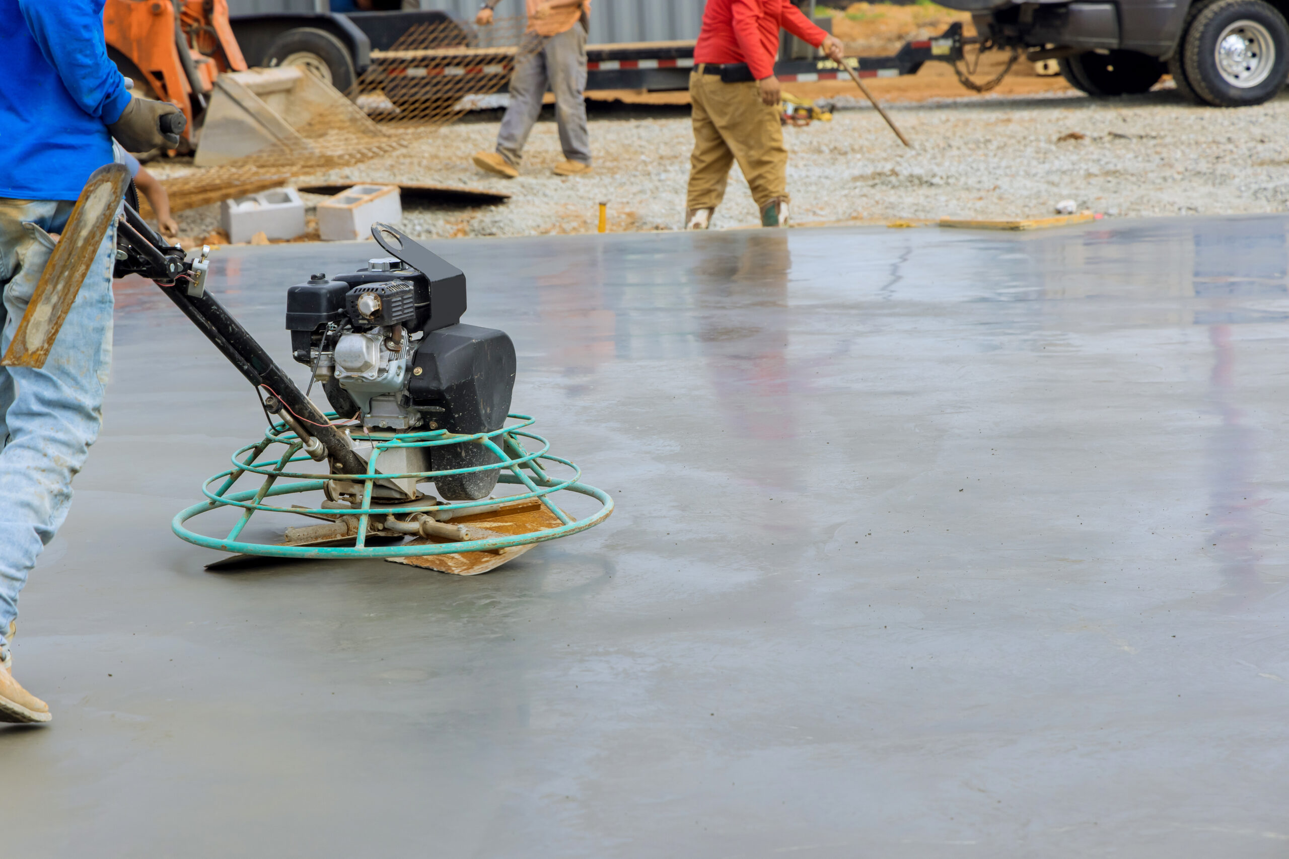 Process polishing and leveling cement screed mortar floors on construction site in process construction